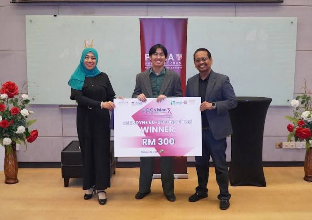People holding an award check at an event